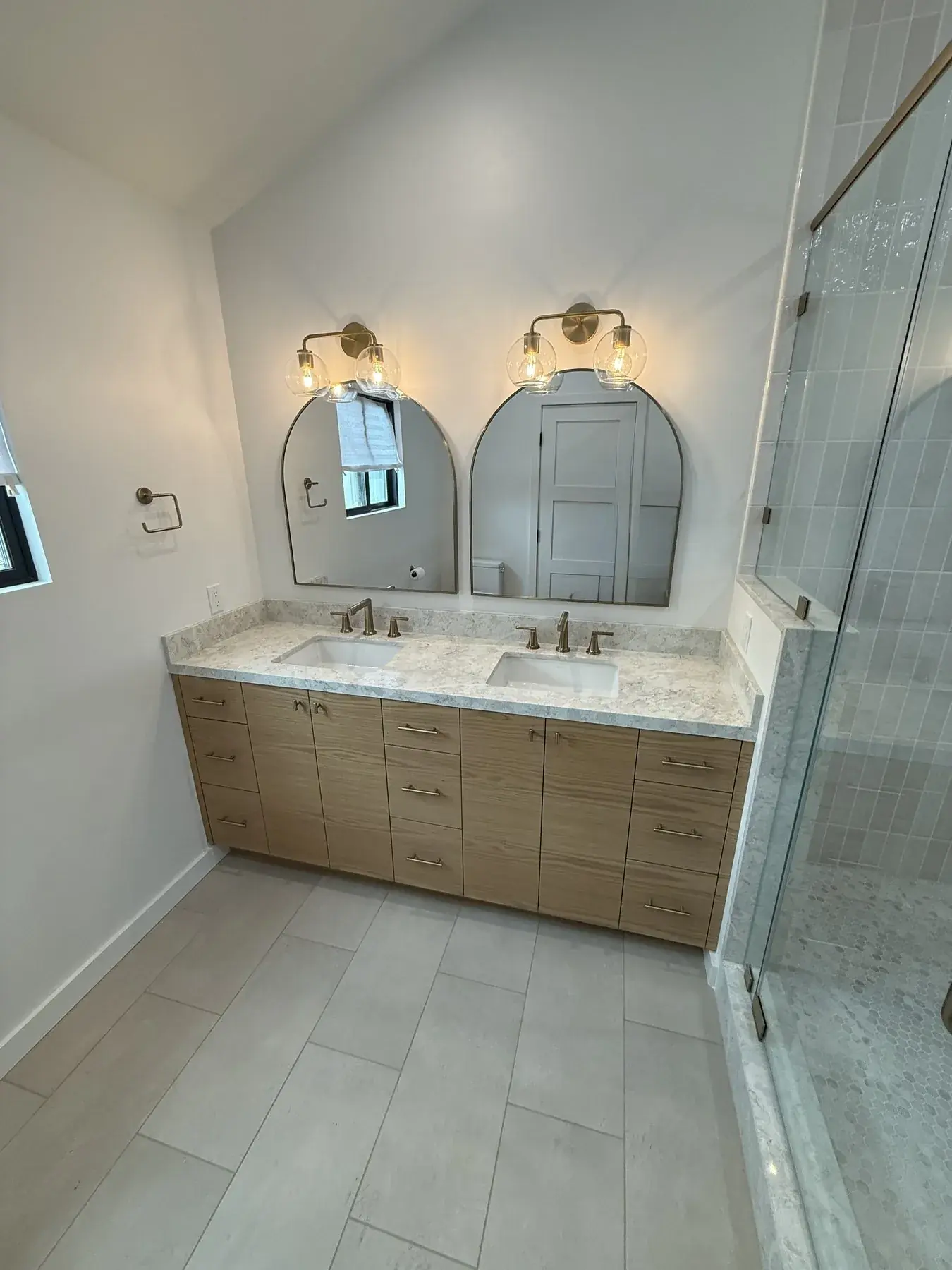 Bathroom vanity with stone top and mirror