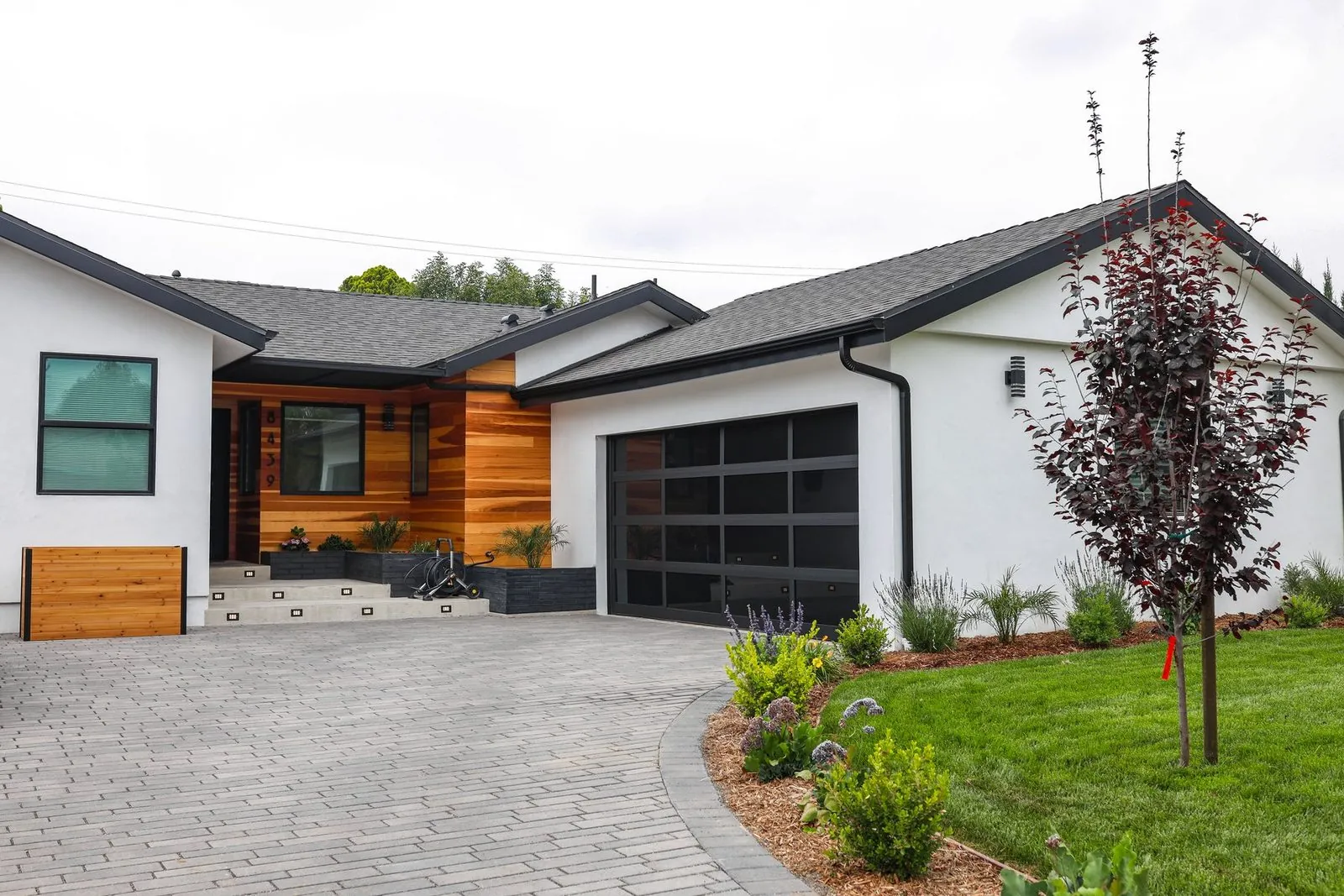 Full home remodel, modern exterior with cedar siding